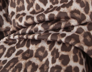 Close-up of leopard print fabric texture showing soft draping and high elasticity