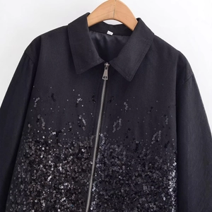 Women's black zip-up jacket with shimmering sequin embellishments and classic lapel collar