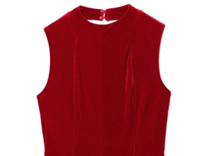 Detail view of red velvet sleeveless dress showing high neck and oval back cutout
