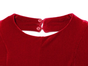 Close-up of velvet dress back neckline featuring dual pink transparent button closures