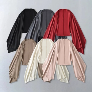Detail of velvet two-piece top showing cape sleeves in six diverse elegant colors