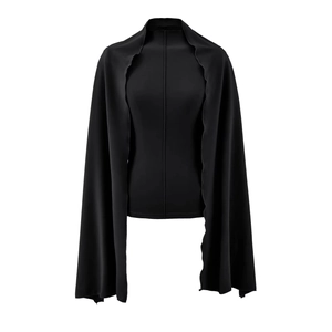 Detailed view of black suede slim fit top with stand collar and shawl overlay