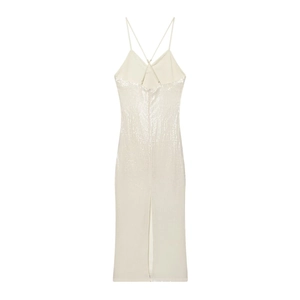 Detail of white sequin midi dress featuring thin criss-cross straps and back slit design
