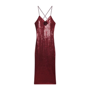 Detail of burgundy sequin dress showing deep V-neck and 3D floral sequin appliqué