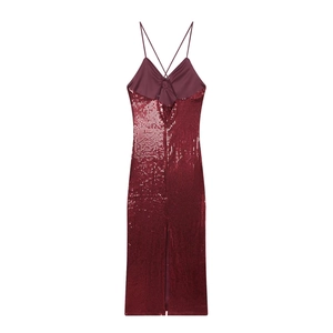 Detail of burgundy sequin dress with spaghetti straps and criss-cross open back design