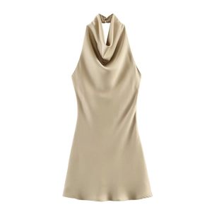 Detail of elegant cowl neck champagne gold satin dress showing neck buckle and fabric sheen
