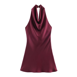 Detail of the elegant cowl neck and back button closure on burgundy satin dress