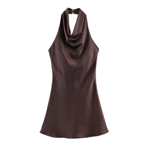 Close-up of chocolate satin halter dress featuring a draped cowl neck and silk texture