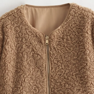 Women's streetwear camel fleece jacket with zipper and plush teddy texture in detail view