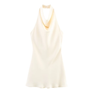 Detail of the champagne satin halter dress showing elegant cowl neck and silky texture