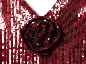 Macro detail of wine red sequin dress featuring a handmade 3D floral rose applique decoration