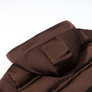 Detail view of brown hooded puffer jacket featuring glossy fabric and quilted texture