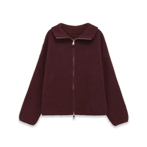 Detail of burgundy ribbed knit cardigan with dual silver zippers and stand collar