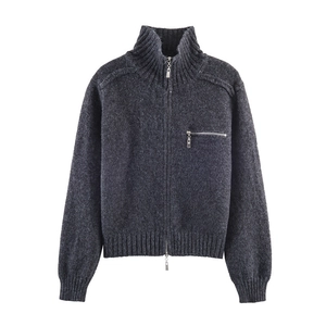 Detail of dark grey knit cardigan showing the wool texture and metal zipper pocket
