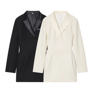 Detail of slim-fit blazer dresses in black and white with satin lapels and waist pleats
