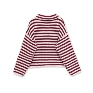 Detailed close-up of the red and pink striped knit sweater with ribbed cuffs and collar