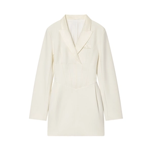 Detail of waist-slimming structure and structured fabric on ivory blazer dress