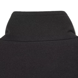 Close-up of black street style short coat featuring a stand collar and fine knit texture