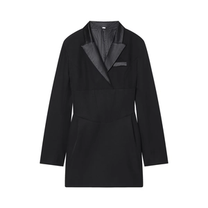 Detail of a black blazer dress featuring a satin lapel and corset-style waist tailoring