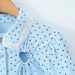Light blue polka dot jumpsuit with lace floral collar and heart-shaped neckline cutout
