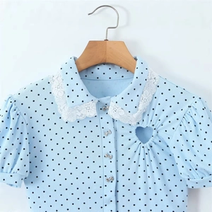 Light blue polka dot jumpsuit with lace Peter Pan collar and heart cutout detail