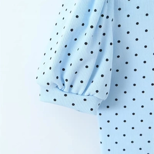Light blue polka dot knit jumpsuit with textured ribbed fabric and puff sleeve details