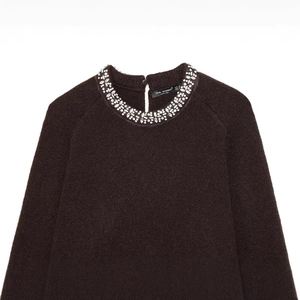Women's dark brown crewneck knit sweater with rhinestone collar and fuzzy texture