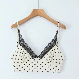 Top senza maniche bianco sporco a pois neri con bordo in pizzo e scollatura a V