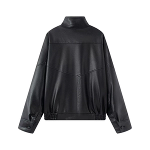 Back view of vintage black leather jacket showing V-shaped seams and elastic hem details