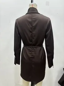 Detail view of chocolate brown satin dress back with waist tie and elegant cuff design
