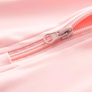 Macro shot of matching pink zipper detail on long sleeve slim fit bodysuit fabric