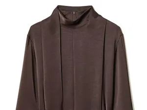 Detail of coffee satin high neck blouse with elegant front pleats and silky texture