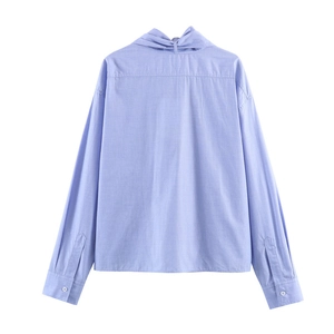 Light blue long sleeve shirt with back twist bow knot design and drop shoulders