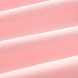 Close-up detail of smooth pink flat-weave fabric with subtle sheen and soft texture