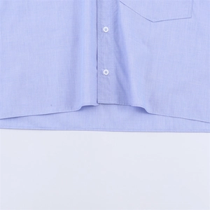 Close-up of light blue casual long sleeve shirt with button-down front and chest pocket