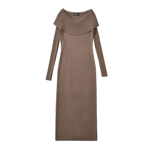Detailed view of dark brown knitted dress featuring elegant pleated layered shawl collar
