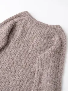 Macro detail of lavender knit sweater showing honeycomb texture and soft mohair texture