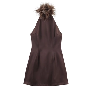 Detail of deep chocolate satin halter dress featuring premium ostrich feather neckline