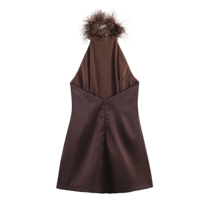 Detail of chocolate brown halter neck satin dress with fluffy feather trim neckline