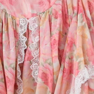 Slim-fit winter dress with pink floral pattern and delicate white lace edge detailing