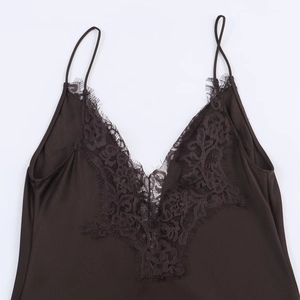 Detail of dark brown satin camisole with delicate floral eyelash lace at the V-neckline