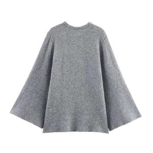 Detail of grey wool knit cardigan featuring soft texture and wide flared sleeves