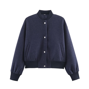Detail of navy blue wool jacket with silver metal buttons and ribbed varsity collar