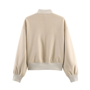 Rear view of beige textured tweed jacket with drop shoulders and ribbed knit trims