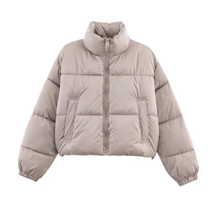Close-up of glossy quilted puffer jacket with high collar and front zipper detail