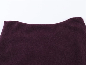 Close-up of soft deep purple knit fabric texture and smooth neckline detail
