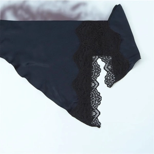 Close-up of slim-fit dress featuring premium satin fabric and delicate black lace trim