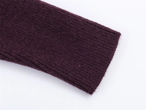 Detail shot of deep purple rib knit cuff with soft texture and refined stitching