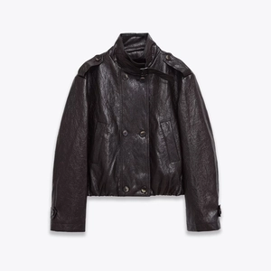 Close-up of black textured PU leather jacket featuring double-breasted buttons and stand collar