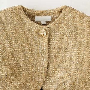 Short gold tweed jacket with padded shoulders and metallic threads for women